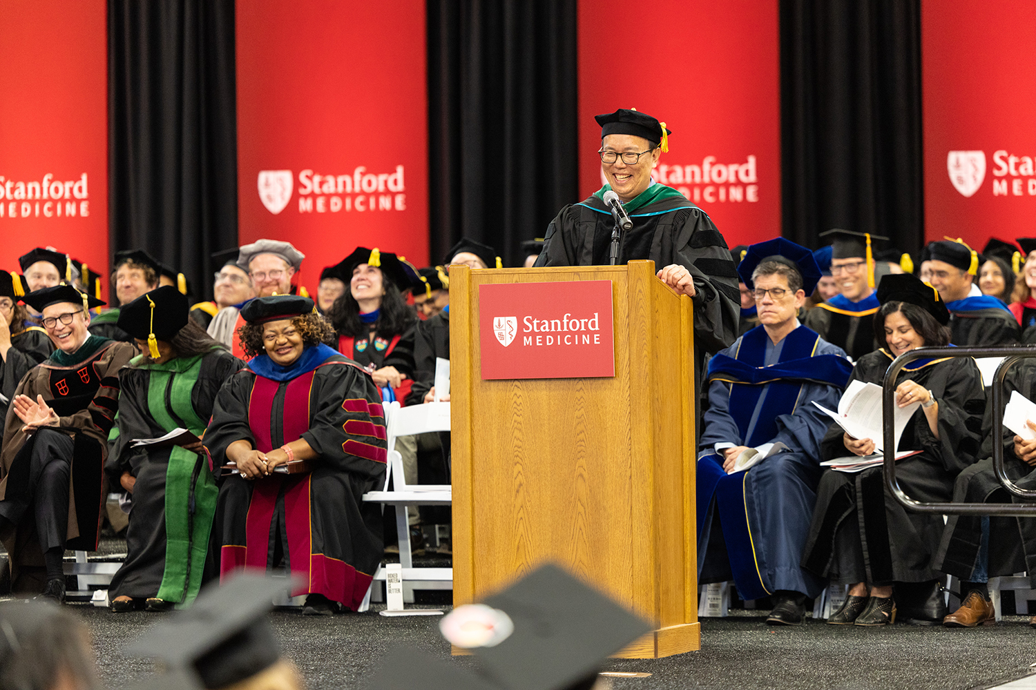 Image of keynote speaker Bryant Lin delivering his speech during the ceremony.